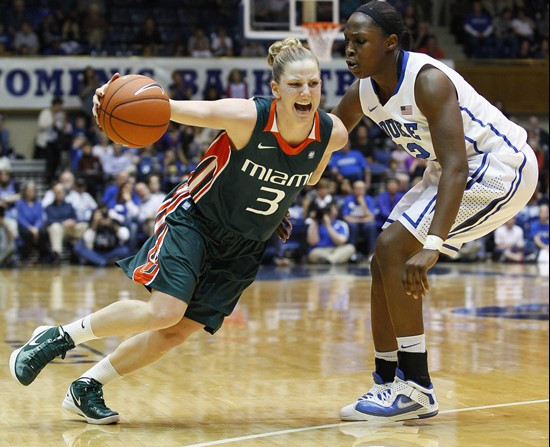 Duke's Chelsea Gray, right, guards Miami's Stefanie Yderstrom (3) during the second half. (AP Photo/Gerry Broome)