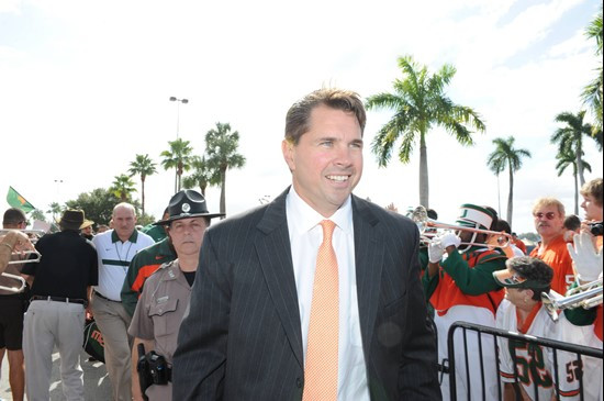 University of Miami Hurricanes head coach Al Golden leads his team in front of the stadium the human tunel before the game against the Boston College...