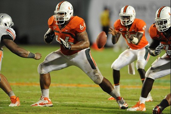 University of Miami Hurricanes offensive lineman Harland Gunn #66 gets set to block in a game against the Ohio State Buckeyes at Sun Life Stadium on...
