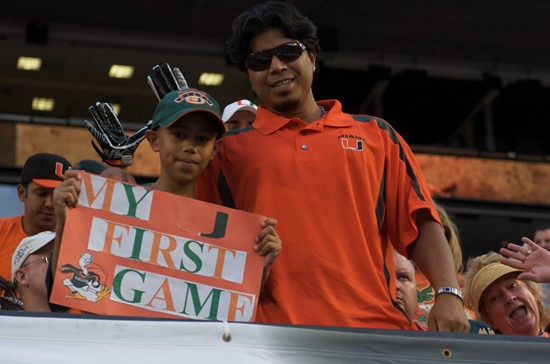 Brandon Joseph Almengor enjoys his first University of Miami game with his Father at SunLife Stadium on November 20, 2010.  Photo by Steven Murphy