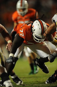 University of Miami Hurricanes offensive lineman Brandon Washington #72 gets set to block in a game against the Georgia Tech Yellow Jackets at Land...