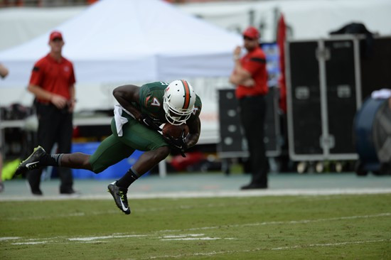 University of Miami Hurricanes wide receiver Phillip Dorsett #4 catches a pass from quarterback Brad Kaaya in a game against the Arkansas State Red...
