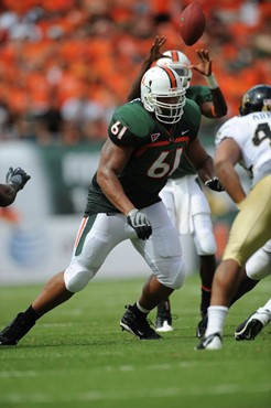 University of Miami Hurricanes offensive lineman Joel Figueroa #61 plays in a game against the Deamon Deacons of Wake Forest at Dolphin Stadium on...
