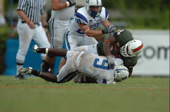 University of Miami defensive end Eric Moncur #94 thwarts the Blue Devils late fourth quarter drive by tackling their quarterback in a game at the...