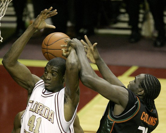 Florida State's Uche Echefu, left, and Miami's Dwayne Collins battle for a first-half rebound during a college basketball game Saturday, Jan. 20,...