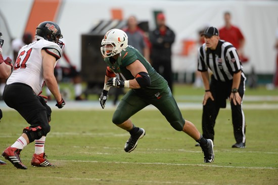 University of Miami Hurricanes defensive lineman Anthony Chickillo #71 makes a sack in a game against the Arkansas State Red Wolves at Sun Life...