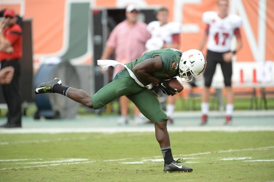 University of Miami Hurricanes wide receiver Phillip Dorsett #4 plays in a game against the Arkansas State Red Wolves at Sun Life Stadium on...