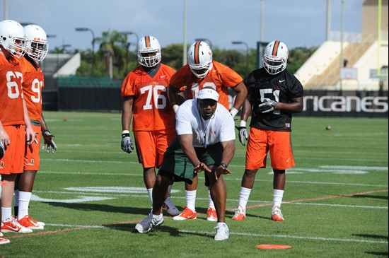 University of Miami Defenisve Line Coach, Jethro Franklin, instructs his team on how he wants them to execute his game plan during a spring practice...