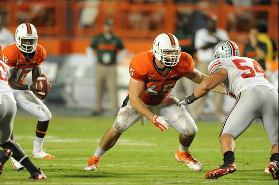 University of Miami Hurricanes offensive lineman Brandon Linder #65 gets set to block in a game against the Ohio State Buckeyes at Sun Life Stadium on...