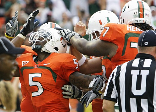 Miami running back Mike James (5) celebrates with teammates after scoring a touchdown against Duke. (AP Photo/Lynne Sladky)