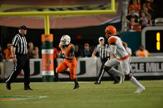 University of Miami Hurricanes running back Duke Johnson #8 catches a deflected pass in a game against the Florida A&M Rattlers at Sun Life Stadium on...