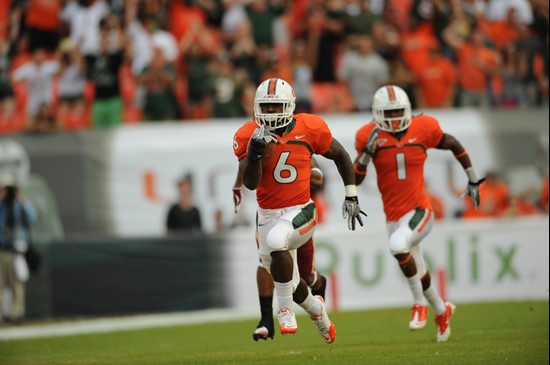 University of Miami Hurricanes running back Lamar Miller #6 carries the ball against the Boston College Eagles at Sun Life Stadium on November 25,...