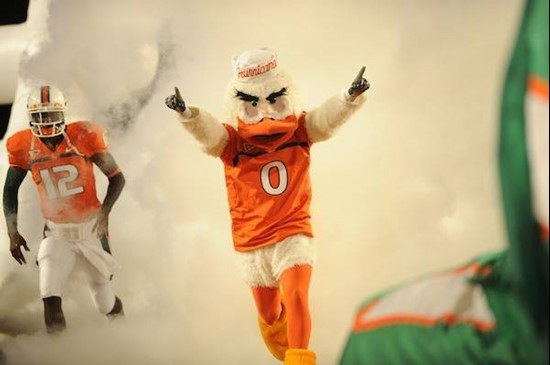 Sebastian the Ibis leads the University of Miami Hurricanes through a tunnel of smoke in  a game against the Georgia Tech Yellow Jackets at Land Shark...