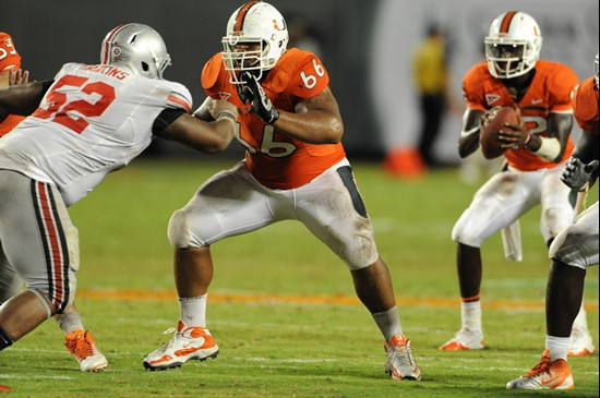 University of Miami Hurricanes offensive lineman Harland Gunn #66 gets set to block in a game against the Ohio State Buckeyes at Sun Life Stadium on...