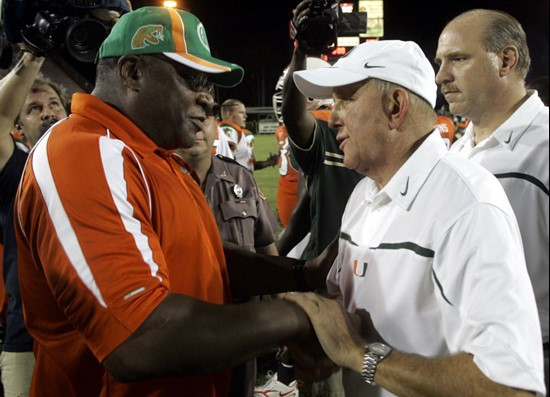 Florida A&M head coach Rubin Carter, left, and Miami head coach Larry Coker congratulate each other after Miami defeated Florida A&M, 51-10, Saturday,...