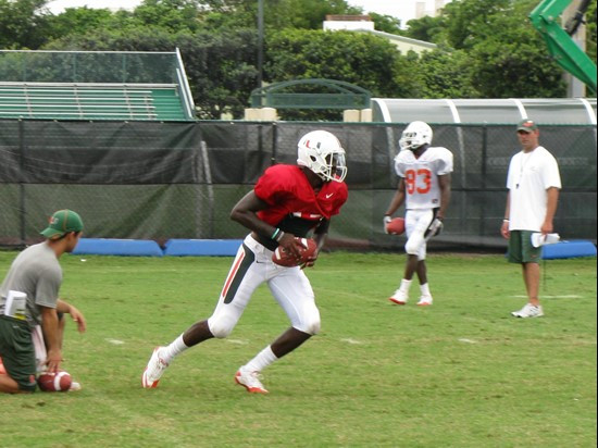 Senior Jacory Harris prepares for a hand-off during team drills.