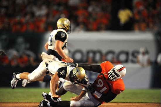 University of Miami Hurricanes defensive tackle Joe Joseph #91 sacks the Bucs quarterback in a game against Charleston Southern University in the...