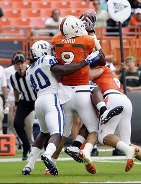 Miami tight end Chase Ford (9) catches a pass for a touchdown as Duke safety Matt Daniels (40) defends. (AP Photo/Lynne Sladky)