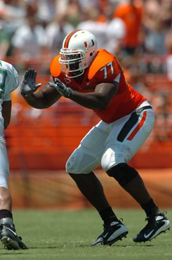 University of Miami offensive lineman Reggie Youngblood gets set to block against the Marshall University defensive lineman in a game at the Orange...