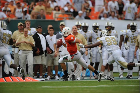 University of Miami Hurricanes quarterback Robert Marve #9 rushes in a game against the University of Central Florida Knights at Dolphin Stadium on...