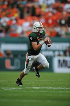 University of Miami Hurricanes quarterback Robert Marve #9 completed 11 passes on 20 attempts for 153 yards and rushed 9 times for 56 yards in a game...