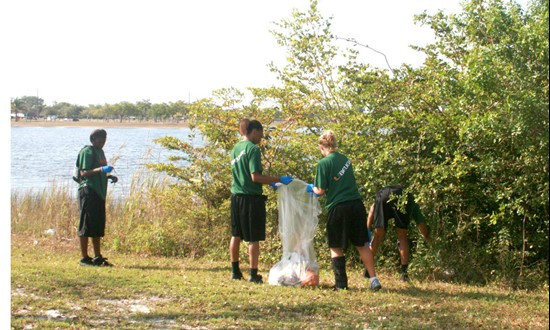 UM Staff, Coaches & Student Athletes volunteer at Amelia Earhart Park Community Service Project.