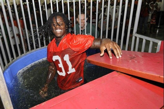 Sean Spence in a dunk tank at BankUnited CanesFest