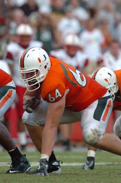 University of Miami offensive lineman Jason Fox #64 gets set to block in a game against the North Carolina State Wolfpack at the Orange Bowl on...