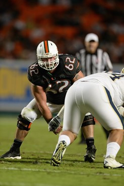 University of Miami Hurricanes offensive lineman Shane McDermott #62 plays in a game against The Pittsburgh Panthers at Sun Life Stadium on November...