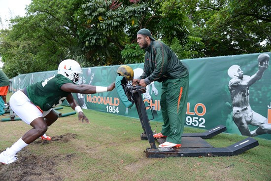 Defensive linemen hit the sleds with GA Kareem Brown