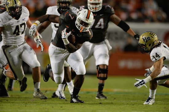 University of Miami Hurricanes running back Gus Edwards #7 and the Canes take on The Pittsburgh Panthers at Sun Life Stadium on November 29, 2014. ...