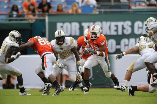 University of Miami Hurricanes running back Lee Chambers #32 plays in a game against the University of Central Florida Knights at Dolphin Stadium on...