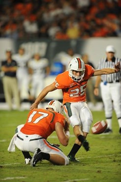 University of Miami Hurricanes kicker/punter Matt Bosher #25 kicks in a game against the Georgia Tech Yellow Jackets at Land Shark Stadium on...