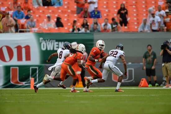 University of Miami Hurricanes running back Gus Edwards #7 and the Canes take on the Virginia Cavaliers at Sun Life Stadium on November 23, 2013. ...