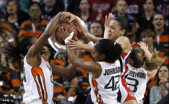 Gonzaga's Haiden Palmer, second from right, competes with Miami's Jessica Capers, left, Shenise Johnson and Stefanie Yderstrom for a loose ball in the...