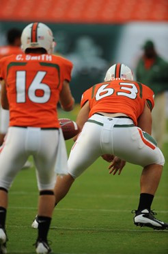 University of Miami Hurricanes quarterback Cannon Smith #16 and offensive lineman Tyler Horn #63  warm up for a game against the University of Central...