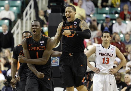 Miami's Durand Scott (1) and Julian Gamble (45) react as Virginia's Sammy Zeglinski (13) looks on after Scott tied the game in regulation in the...