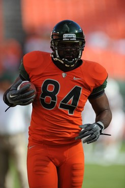 University of Miami Hurricanes tight end Richard Gordon #84 warms up before a game against the Virginia Tech Hokies at Sun Life Stadium on November...