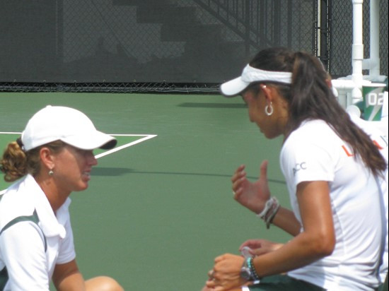 Head coach Paige Yaroshuk-Tews with the doubles team of Kayla Rizzolo and Gabriela Mejia Saturday at the Neil Schiff Tennis Center.