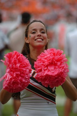 A University of Miami Hurricane cheerleader entertains fans in a game against the University of Central Florida Knights at Dolphin Stadium on October...