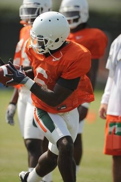 University of Miami Hurricanes running back Lamar Miller #6 rushes at Greentree Practice Field on August 13 in afternoon drills to prepare for the...