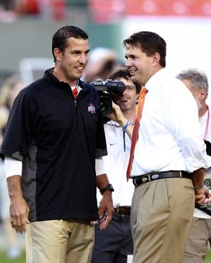 Ohio State head coach Luke Fickell, left, and Miami head coach Al Golden talk before the start of an NCAA college football game, Saturday, Sept. 17,...