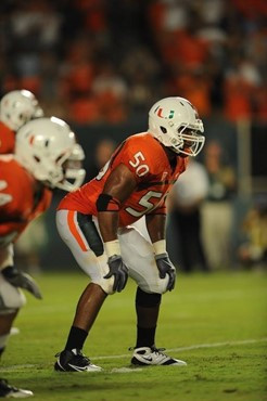 University of Miami Hurricanes linebacker Darryl Sharpton #50 plays in a game against the Georgia Tech Yellow Jackets at Land Shark Stadium on...