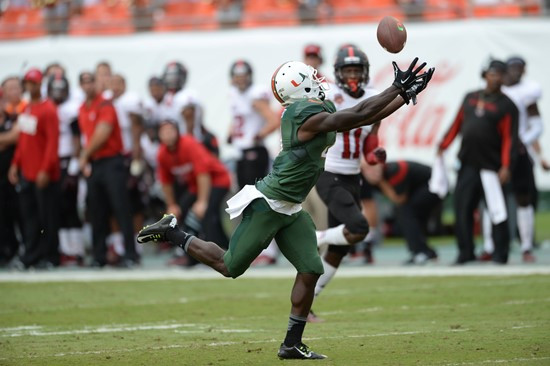 University of Miami Hurricanes wide receiver Phillip Dorsett #4 catches a pass from quarterback Brad Kaaya in a game against the Arkansas State Red...