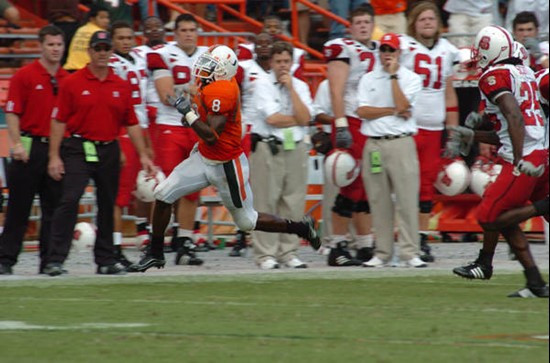 University of Miami wide receiver Darnell Jenkins #8 catches a pass from quarterback Kirby Freeman #7 in a game against the North Carolina State...