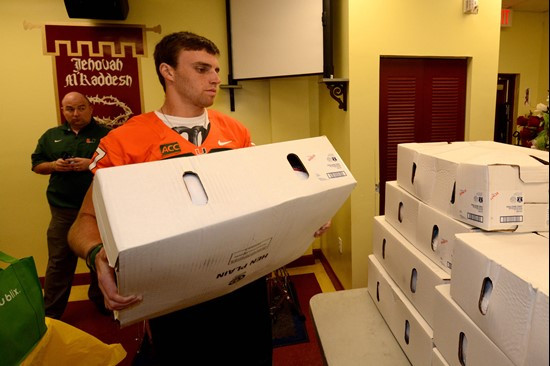 Alex Irastorza carries one of the turkey boxes Tuesday.