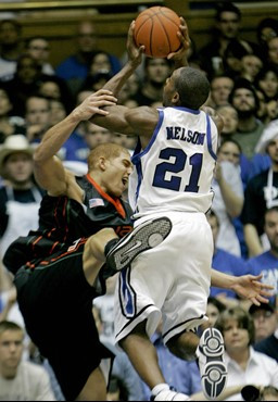 Duke's DeMarcus Nelson (21) drives to the basket as Miami's Jimmy Graham defends during the second half of a college basketball game in Durham, N.C.,...