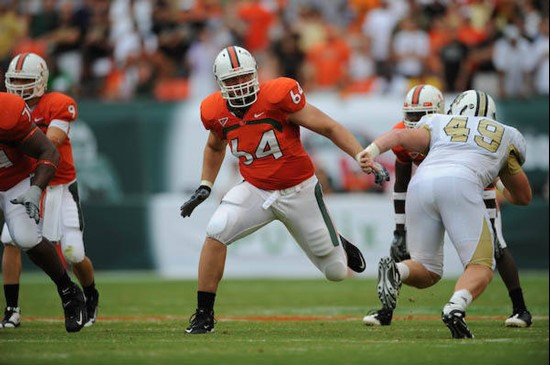 University of Miami Hurricanes offensive tackle Jason Fox #64 plays in a game against the University of Central Florida Knights at Dolphin Stadium on...