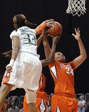 Miami's Suriya McGuire, left, defends Clemson's Natiece Ford, right, during the second half of an NCAA college basketball game Sunday, Feb. 5, 2012,...