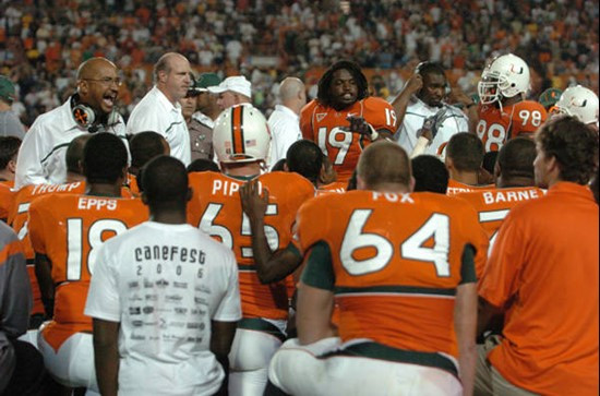 University of Miami Hurricanes safety Brandon Meriweather #19 and coaches talk with teammates after a midfield bench clearing brawl between the...